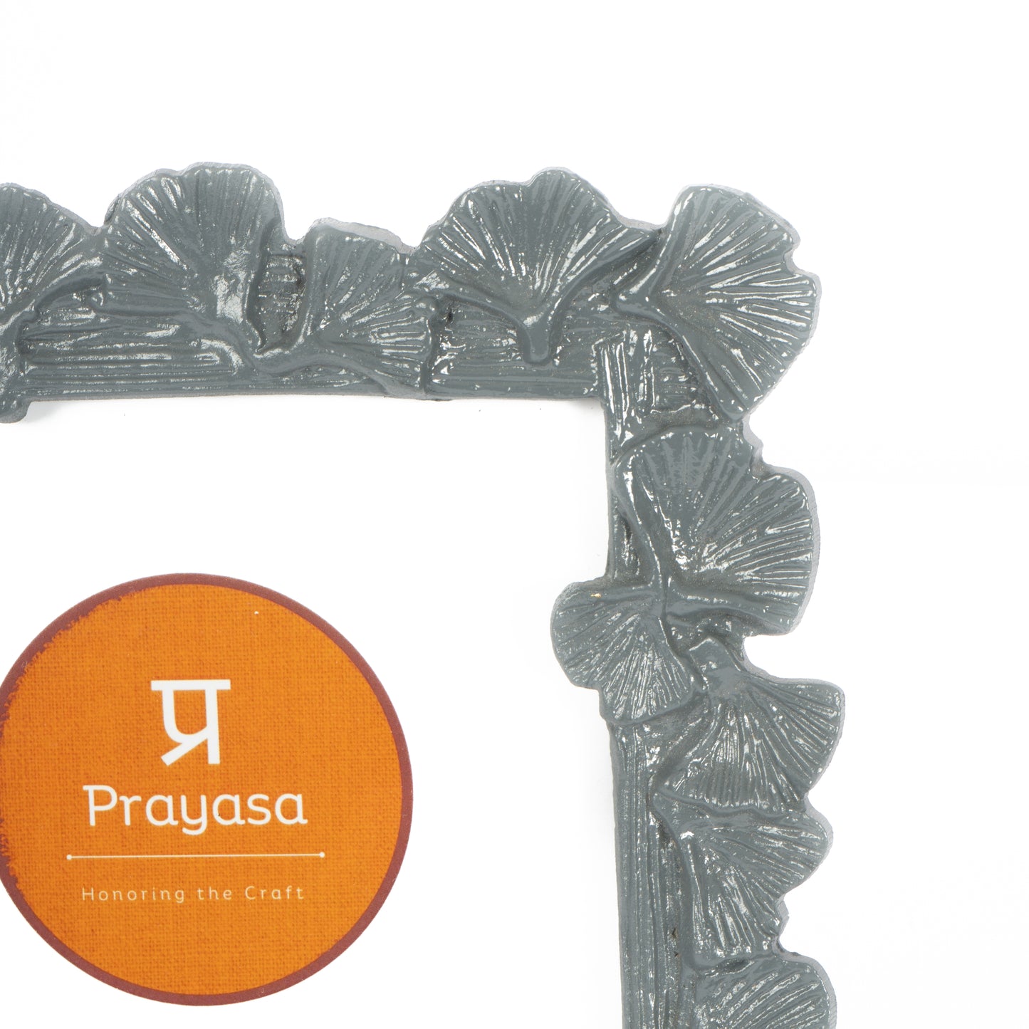 Decorative frame with 'Prayasa' branding on an orange label
