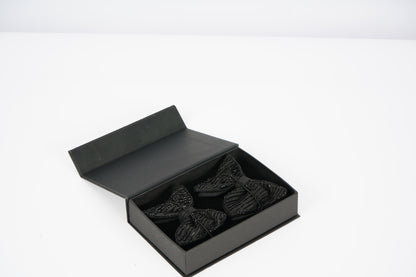 Black bow ties in an black box for gifting