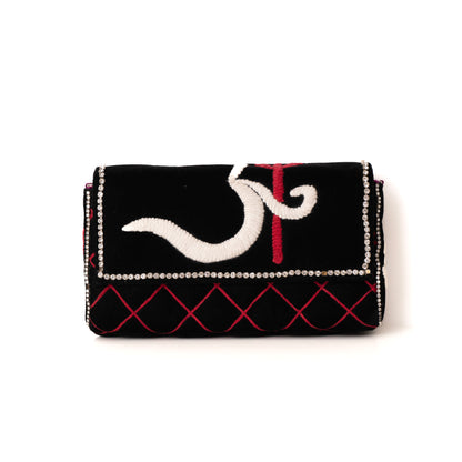 Black clutch with white and red design on a white background
