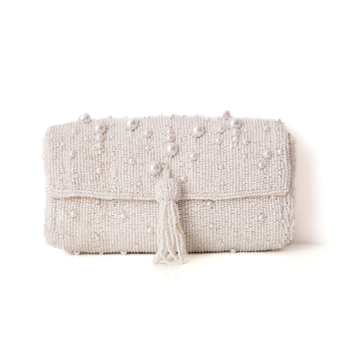 Beaded clutch bag with tassels on a white background