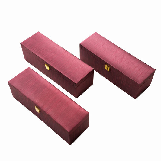 Three red rectangular boxes with gold accents on a white background
