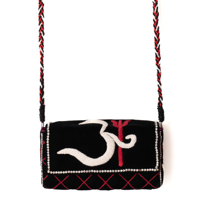 Black handbag with white and red design on a white background