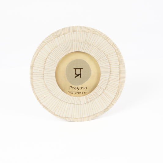 Round beige product with 'Prayasa' logo on a white background