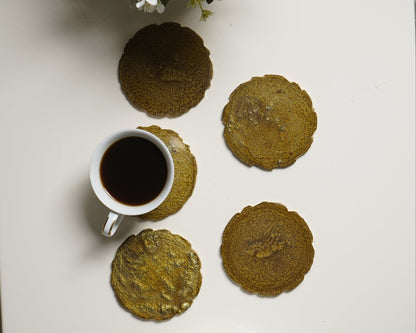 Tea set with cookies and flowers on a white surface