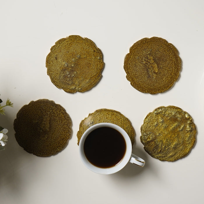 Tea set with cookies and flowers on a white surface