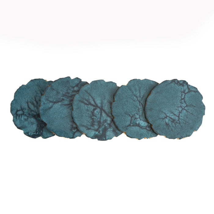Set of five blue stone coasters on a white background