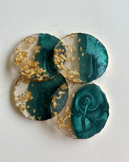 Decorative item with teal and gold design on a white background