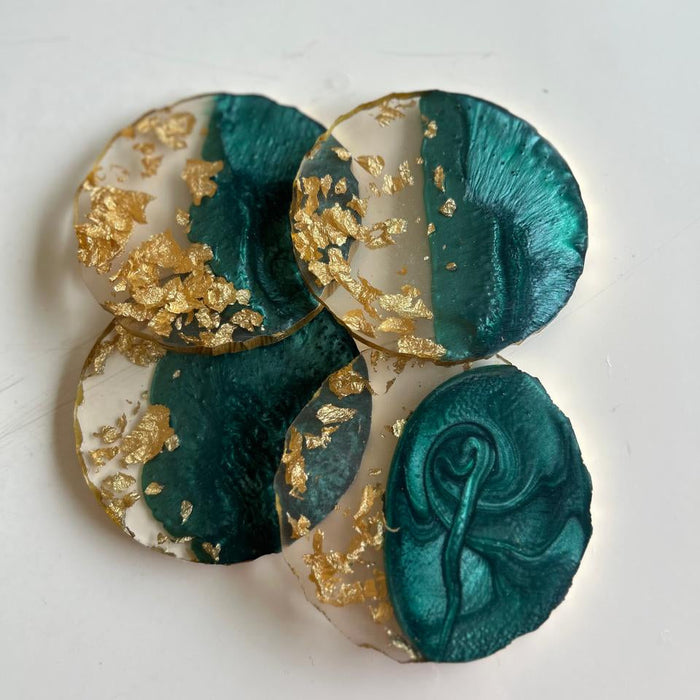Decorative item with teal and gold design on a white background