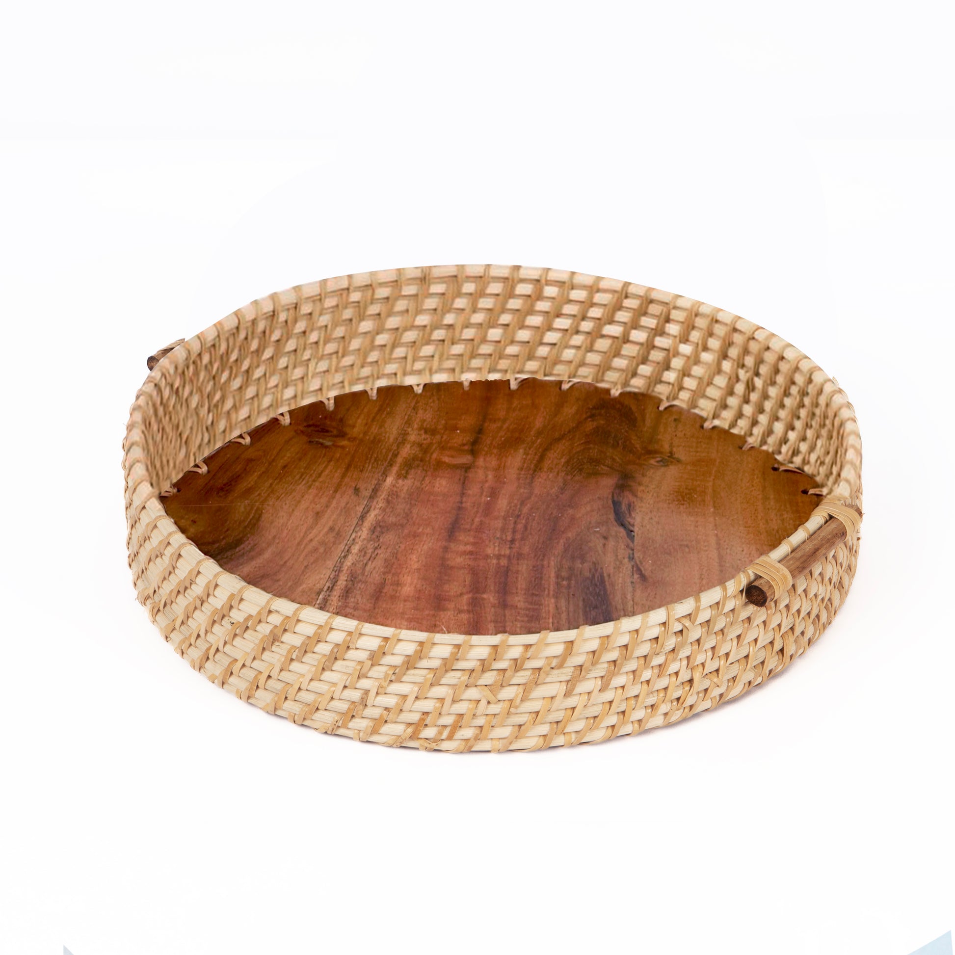 Round wooden bowl with woven rim on a white background