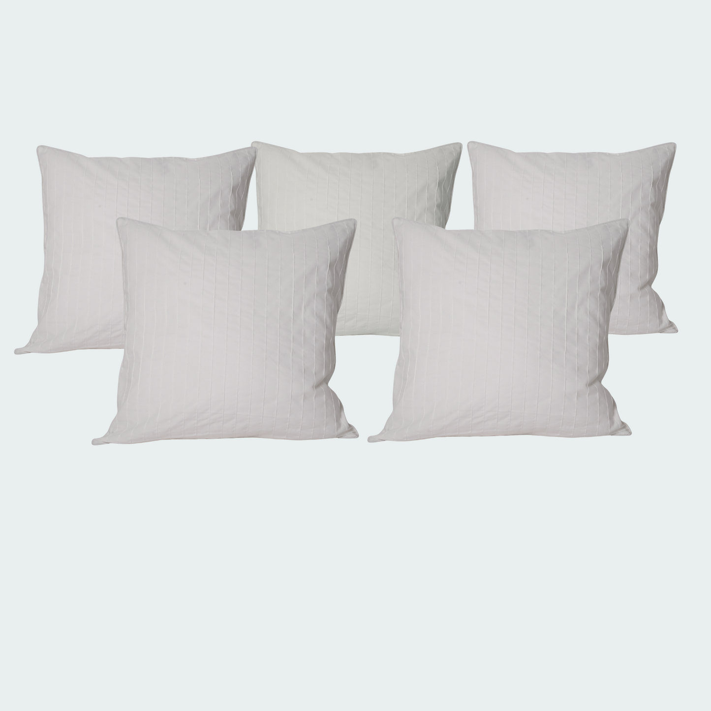 Set of five white pillows.
