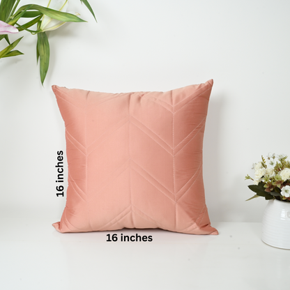 Pink pillow with chevron pattern on a white background, measurement text included.