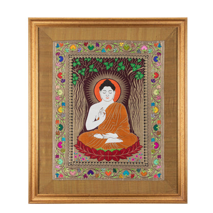 Framed artwork of a seated Buddha figure with colorful floral border